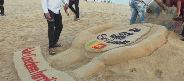 Artista rinde homenaje a las víctimas de Sri Lanka con una escultura de arena Artista rinde homenaje a las víctimas de Sri Lanka con una escultura de arena - Sputnik Mundo