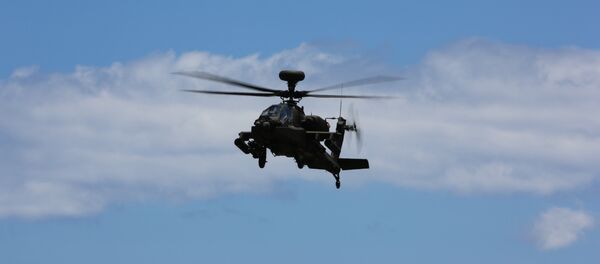 Un AH-64E Apache Un AH-64E Apache - Sputnik Mundo