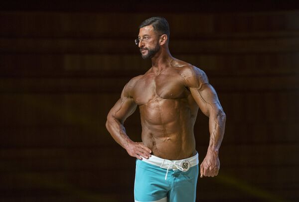 Espectáculo de músculos en el Campeonato de 'Bodybuilding' asiático Espectáculo de músculos en el Campeonato de 'Bodybuilding' asiático - Sputnik Mundo