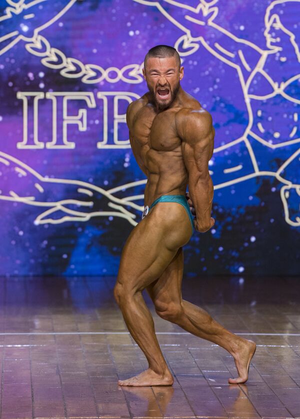 Espectáculo de músculos en el Campeonato de 'Bodybuilding' asiático Espectáculo de músculos en el Campeonato de 'Bodybuilding' asiático - Sputnik Mundo