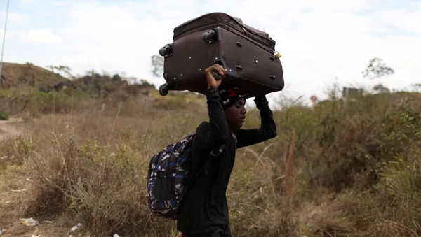 Un migrante venezolano - Sputnik Mundo