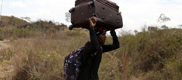 Un migrante venezolano - Sputnik Mundo