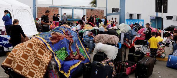 Migrantes venezolanos en la frontera peruana - Sputnik Mundo