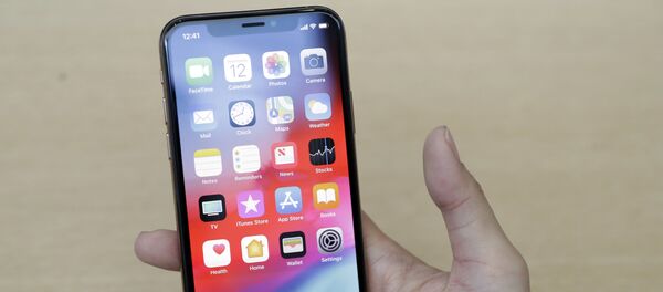 Un iPhone XS - Sputnik Mundo