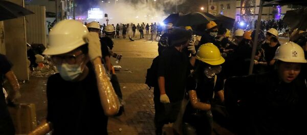 Manifestantes en las protestas de Hong Kong - Sputnik Mundo