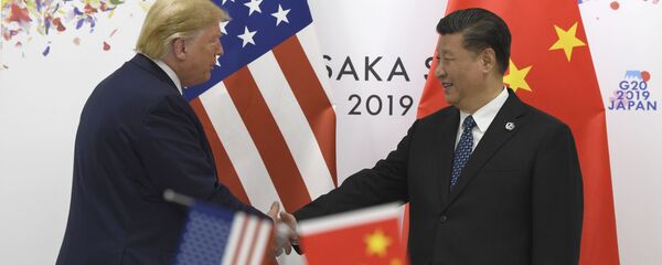 Donald Trump y Xi Jinping durante la cumbre del G20 en Osaka  - Sputnik Mundo