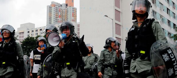 La policía en las protestas de Hong Kong - Sputnik Mundo