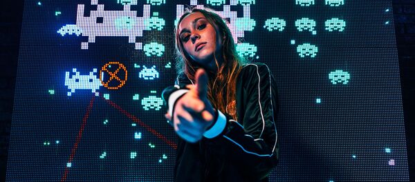 Una 'gamer', imagen referencial - Sputnik Mundo