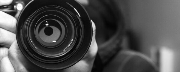 Un fotógrafo (imagen referencial) - Sputnik Mundo