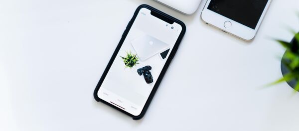 Un iphone X (imagen referencial) - Sputnik Mundo