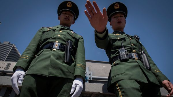 Dos policías chinos (imagen referencial) Dos policías chinos (imagen referencial) - Sputnik Mundo