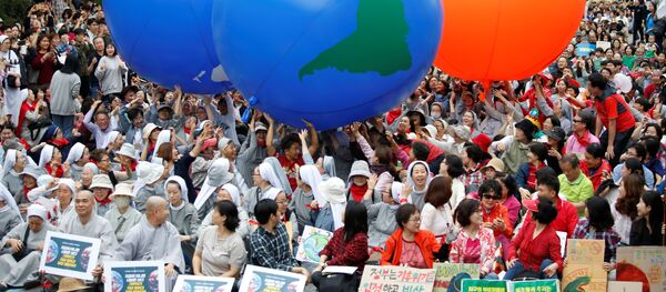 Participantes de una protesta contra el cambio climático en Corea del Sur - Sputnik Mundo