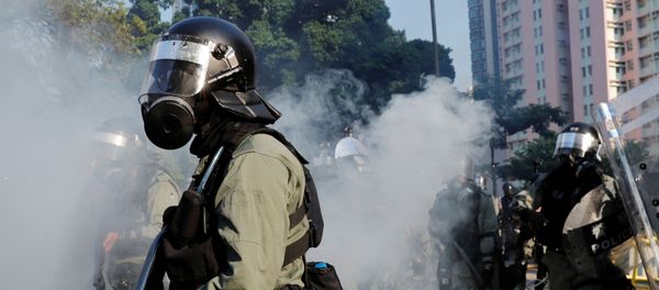 La Policía en las protestas en Hong Kong La Policía en las protestas en Hong Kong - Sputnik Mundo