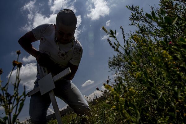 Los brutales asesinatos de mujeres y niños en la periferia de Ciudad de México (fotos y vídeo) - Sputnik Mundo