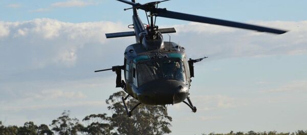 Bell UH-1H Huey, de la Fuerza Aérea Uruguaya, equipado con dos ametralladoras - Sputnik Mundo