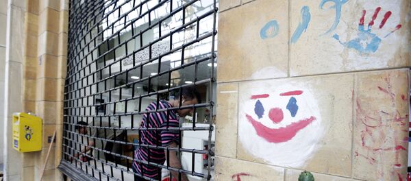 Un grafiti con el rostro del guasón - Sputnik Mundo