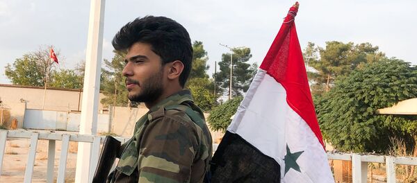 Un combatiente del Ejército sirio - Sputnik Mundo