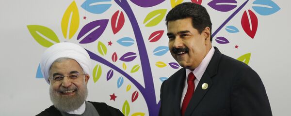 El presidente de Irán, Hasán Rouhaní junto al presidente de Venezuela, Nicolás Maduro El presidente de Irán, Hasán Rouhaní junto al presidente de Venezuela, Nicolás Maduro - Sputnik Mundo