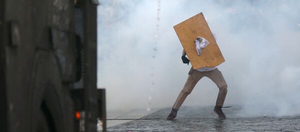 Las protestas en Santiago de Chile Las protestas en Santiago de Chile - Sputnik Mundo