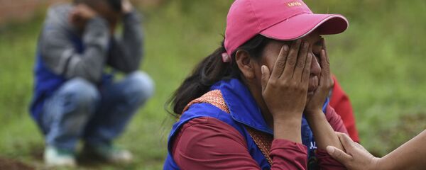 Familiares de los fallecidos durante la masacre del Cauca (Colombia), el 31 de octubre de 2019 Familiares de los fallecidos durante la masacre del Cauca (Colombia), el 31 de octubre de 2019 - Sputnik Mundo