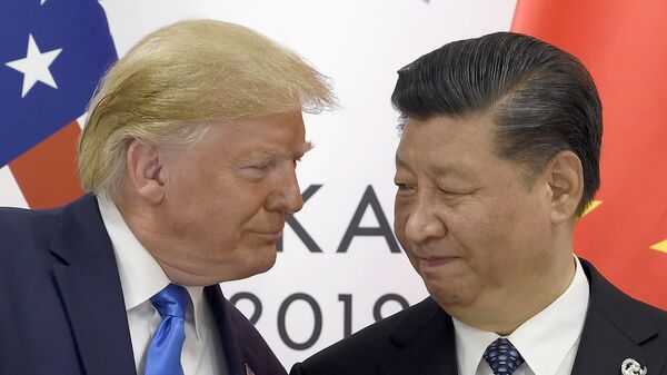 Donald Trump, entonces presidente de EEUU, se reúne con su par chino, Xi Jinping, durante el G20  - Sputnik Mundo