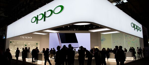 Un estand de Oppo en una feria de tecnología (archivo) - Sputnik Mundo