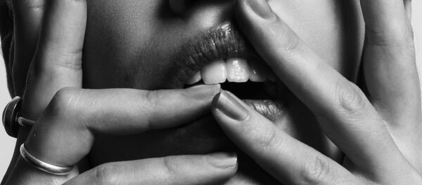 Los labios y los dientes (imagen referencial) - Sputnik Mundo