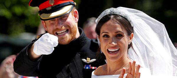El príncipe Enrique y su esposa, Meghan Markle, el día de su boda (archivo) - Sputnik Mundo