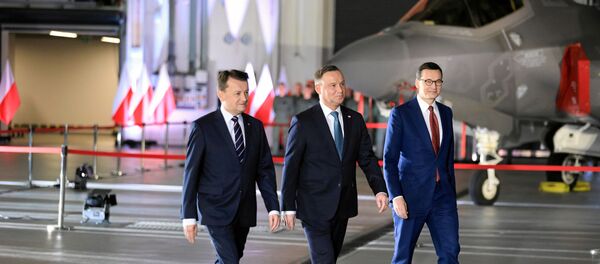 El ministro de Defensa polaco, Mariusz Blaszczak, el presidente, Andrzej Duda, y el primer ministro, Mateusz Morawiecki - Sputnik Mundo