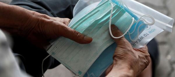 Unas máscaras protectoras contra virus - Sputnik Mundo