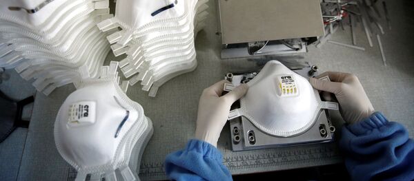 Producción de mascarillas en China (archivo) - Sputnik Mundo