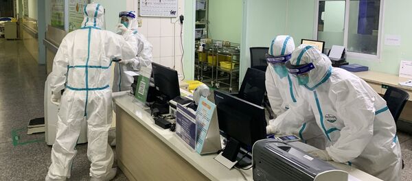 El área de enfermería en un hospital de Wuhan, China - Sputnik Mundo