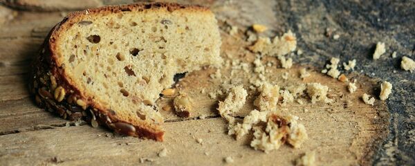 Un pedazo de pan (imagen referencial) - Sputnik Mundo