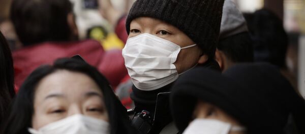 Las mujeres llevan máscaras antibacteriales durante la celebración del Año Nuevo Lunar en la ciudad japonesa de Yokohama - Sputnik Mundo