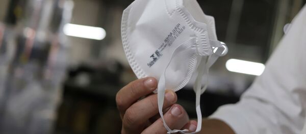 Una mascarilla - Sputnik Mundo