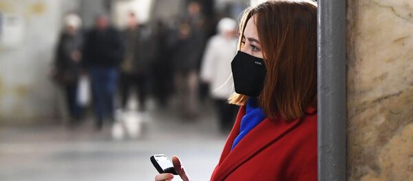 Una mujer en mascarilla (imagen referencial) - Sputnik Mundo