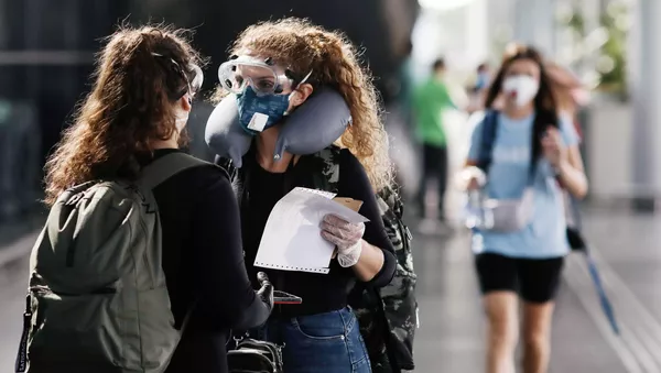 Mujeres en mascarillas (imagen referencial) - Sputnik Mundo
