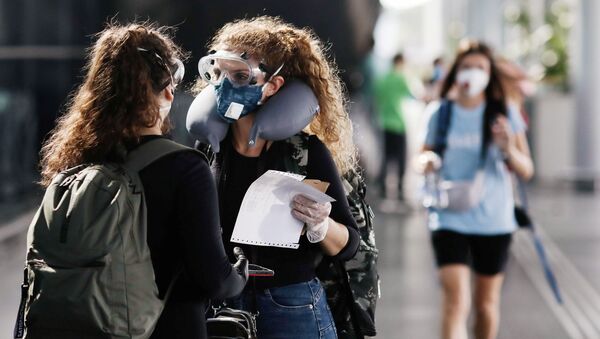 Mujeres en mascarillas (imagen referencial) Mujeres en mascarillas (imagen referencial) - Sputnik Mundo
