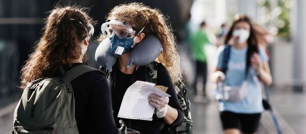 Mujeres en mascarillas (imagen referencial) Mujeres en mascarillas (imagen referencial) - Sputnik Mundo