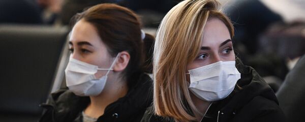 Mujeres en mascarillas (imagen referencial) - Sputnik Mundo