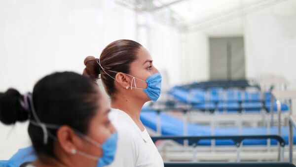 Unas mujeres en mascarillas - Sputnik Mundo