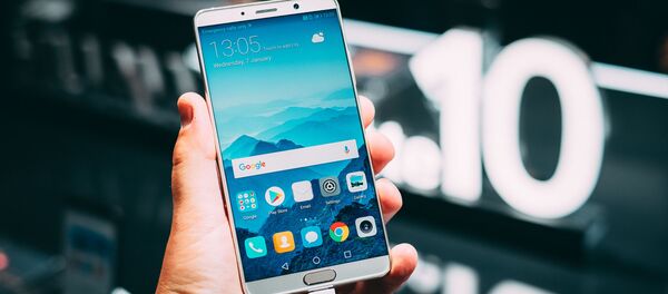 Un teléfono de Huawei Un teléfono de Huawei - Sputnik Mundo