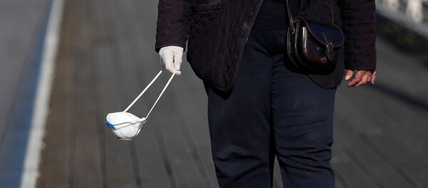 Una mascarilla protectora - Sputnik Mundo