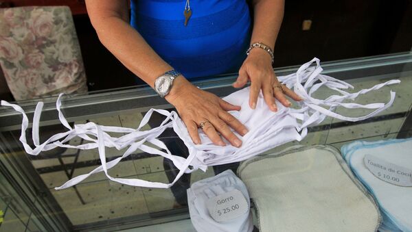 Unas mascarillas en Cuba durante el brote de coronavirus - Sputnik Mundo