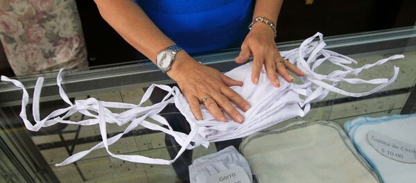 Unas mascarillas en Cuba durante el brote de coronavirus - Sputnik Mundo