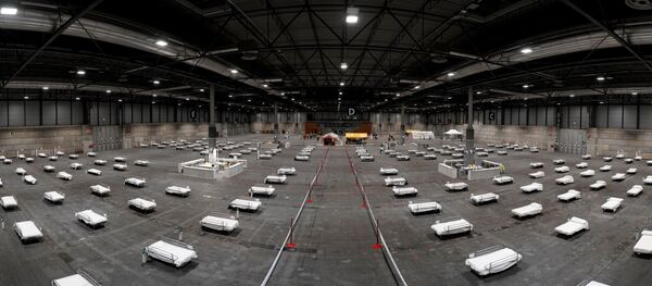 El hospital de campaña desplegado en el recinto ferial de Madrid (IFEMA) El hospital de campaña desplegado en el recinto ferial de Madrid (IFEMA) - Sputnik Mundo