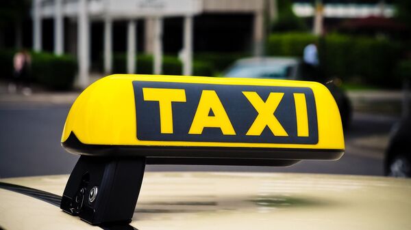 Un taxi - Sputnik Mundo