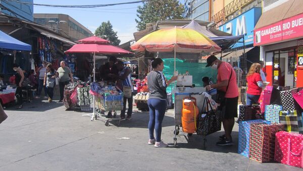 Comercio en centro de Santiago 26 marzo 2020 - Sputnik Mundo