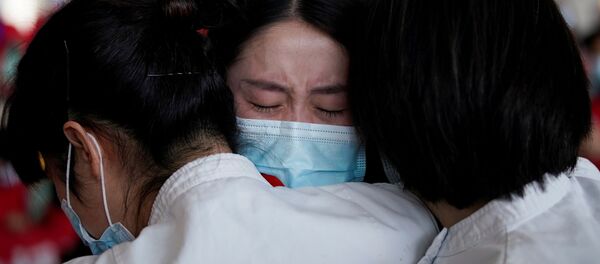 Медицинские работники в международном аэропорту Ухань-Тяньхэ, Китай Медицинские работники в международном аэропорту Ухань-Тяньхэ, Китай - Sputnik Mundo