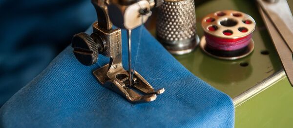 Una máquina de coser - Sputnik Mundo